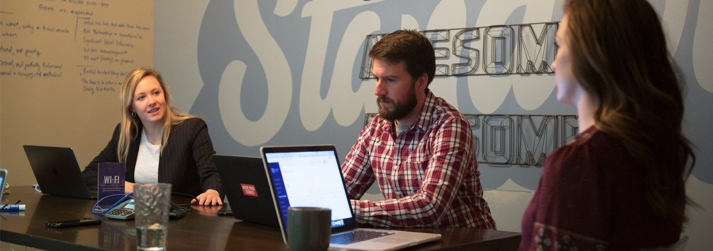 Marketers working around a table